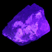 Clear Fluorite stepped cluster 90*80*52mm 523g in UV light - Rocks and Things Store