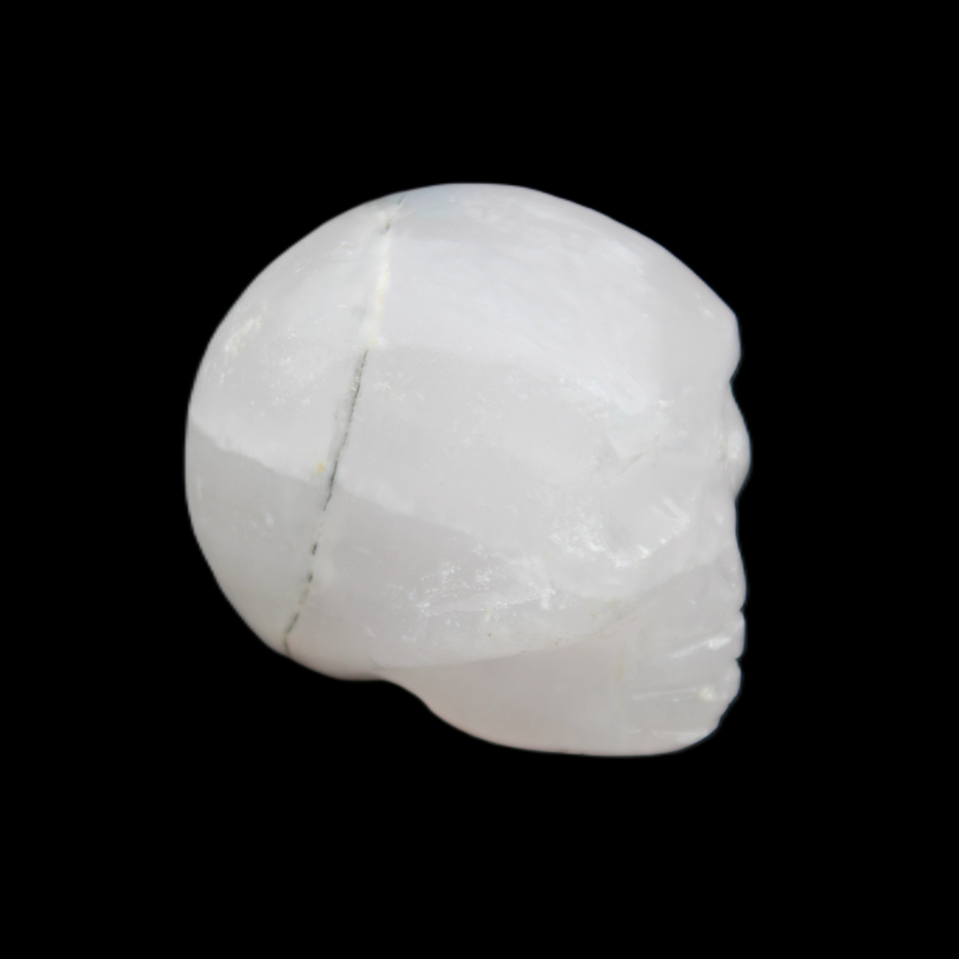 Mangano Calcite skull 35*47*40mm 117g in sunlight - Rocks and Things Store