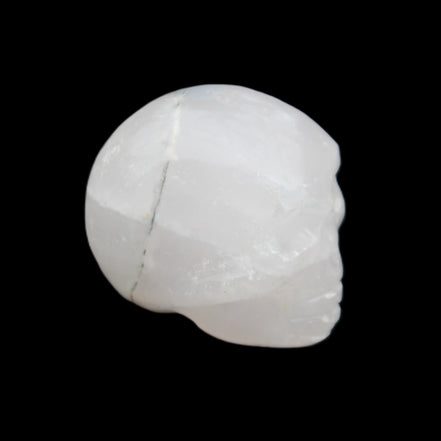 Mangano Calcite skull 35*47*40mm 117g in sunlight - Rocks and Things Store