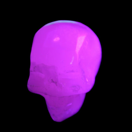 Mangano Calcite skull 35*47*40mm 117g in UV light - Rocks and Things Store