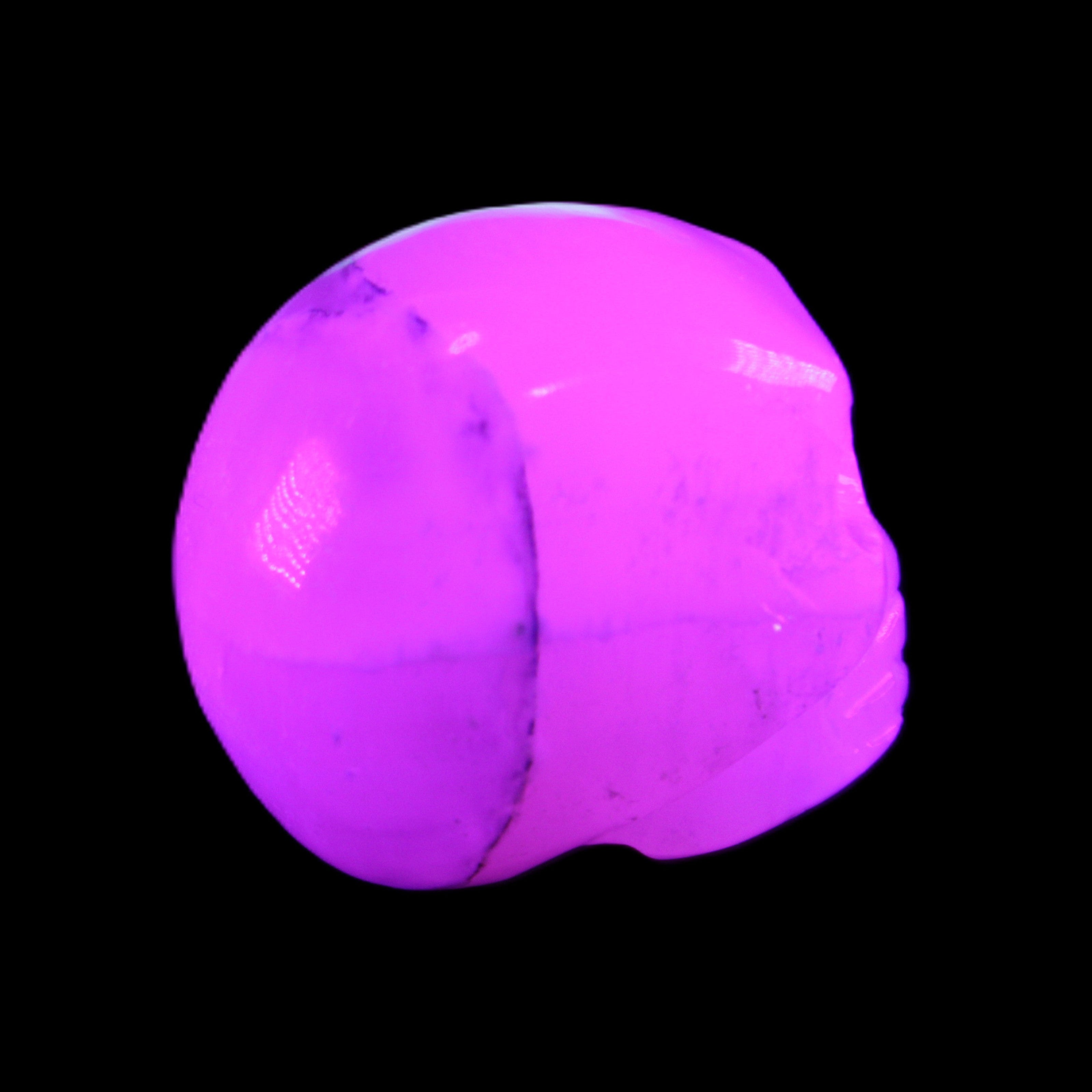 Mangano Calcite skull 35*47*40mm 117g in UV light - Rocks and Things Store