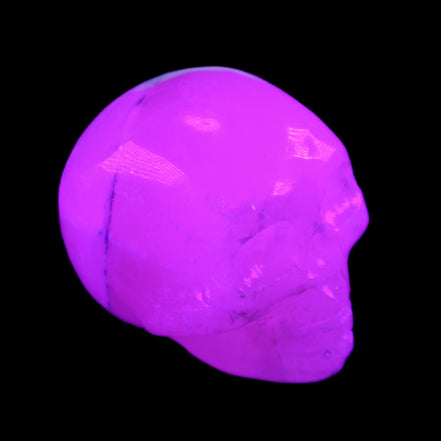 Mangano Calcite skull 35*47*40mm 117g in UV light - Rocks and Things Store