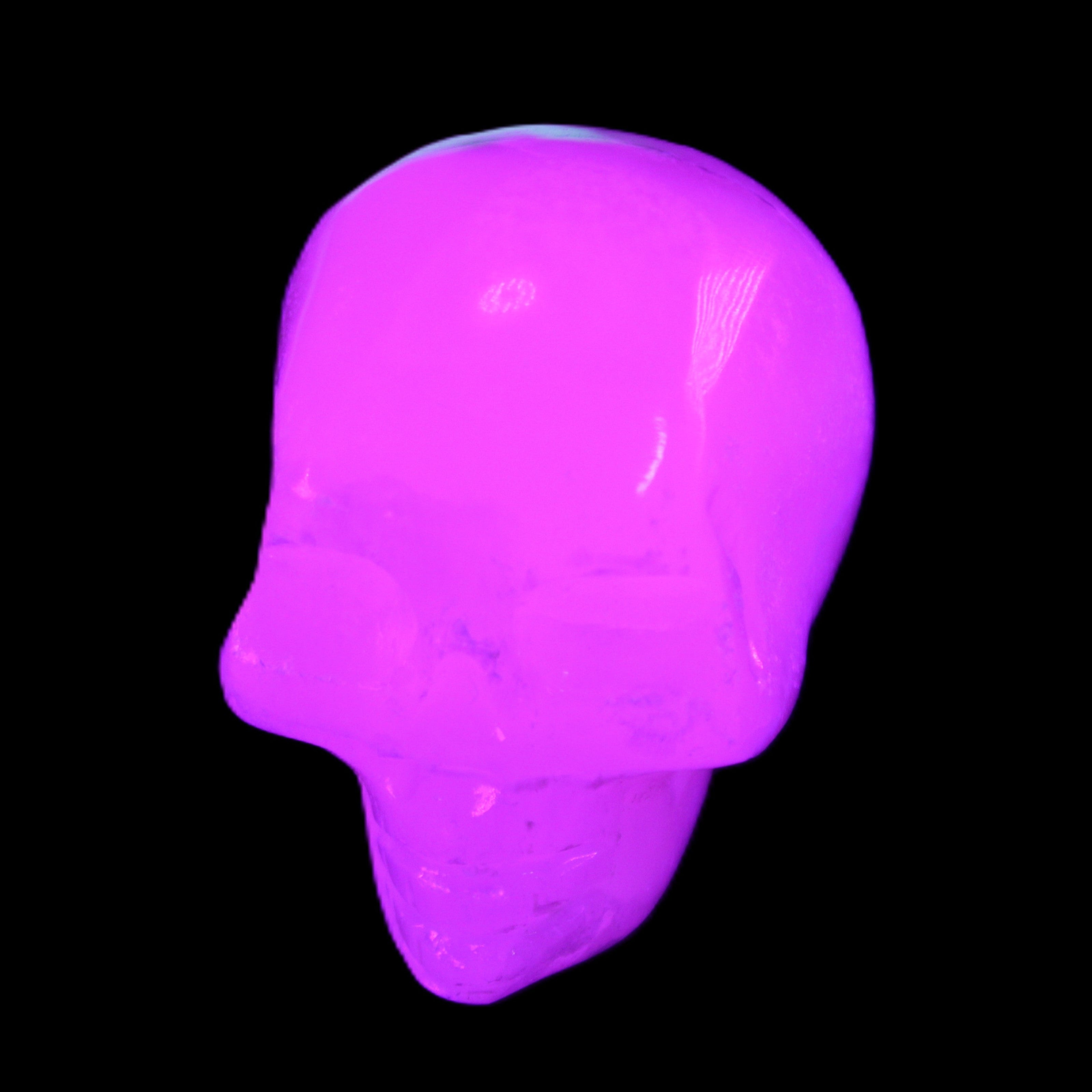 Mangano Calcite skull 35*47*40mm 117g in UV light - Rocks and Things Store