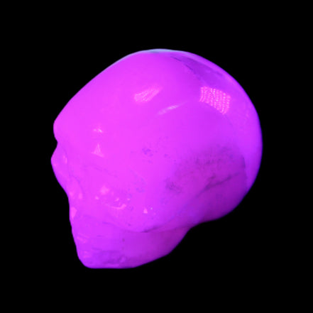 Mangano Calcite skull 35*47*40mm 117g in UV light - Rocks and Things Store