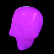 Mangano Calcite skull 35*47*40mm 117g in UV light - Rocks and Things Store