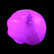 Mangano Calcite skull 35*47*40mm 117g in UV light - Rocks and Things Store