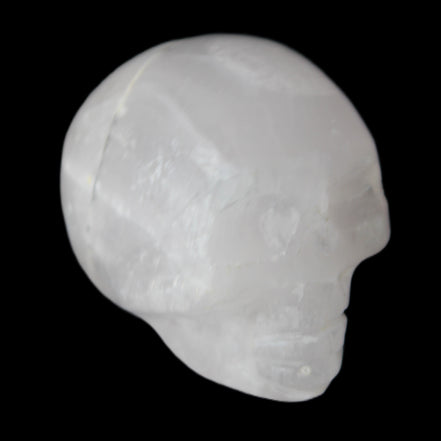 Mangano Calcite skull 35*47*40mm 117g in sunlight - Rocks and Things Store