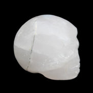 Mangano Calcite skull 35*47*40mm 117g in sunlight - Rocks and Things Store