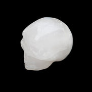 Mangano Calcite skull 35*47*40mm 117g in sunlight - Rocks and Things Store