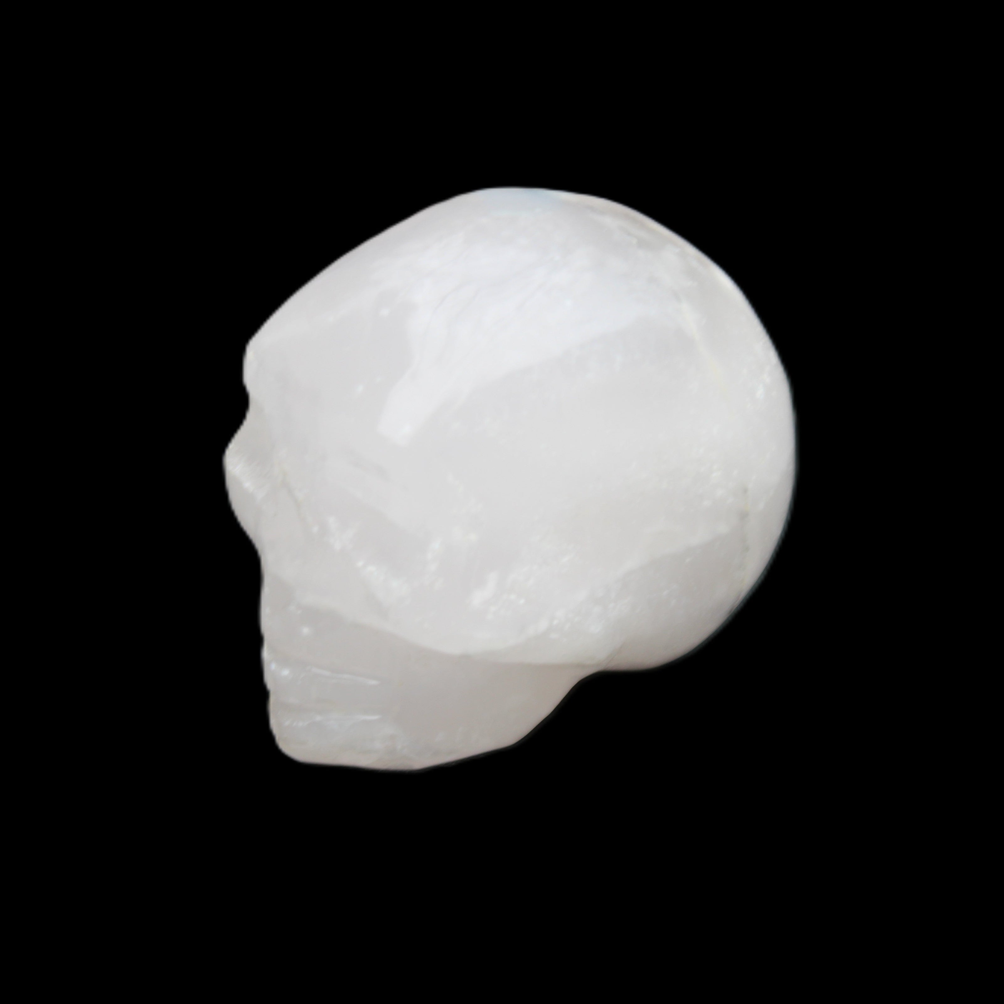 Mangano Calcite skull 35*47*40mm 117g in sunlight - Rocks and Things Store