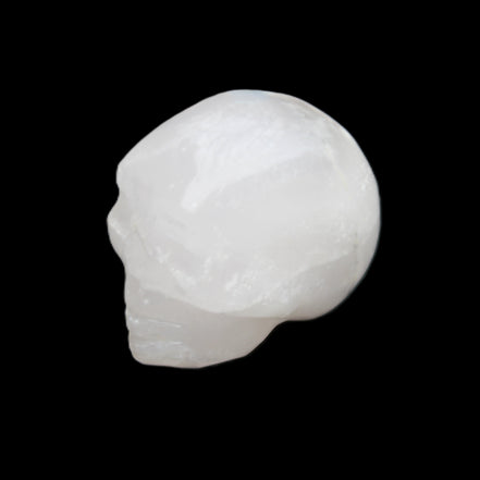 Mangano Calcite skull 35*47*40mm 117g in sunlight - Rocks and Things Store