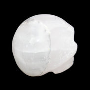 Mangano Calcite skull 35*47*40mm 117g in sunlight - Rocks and Things Store