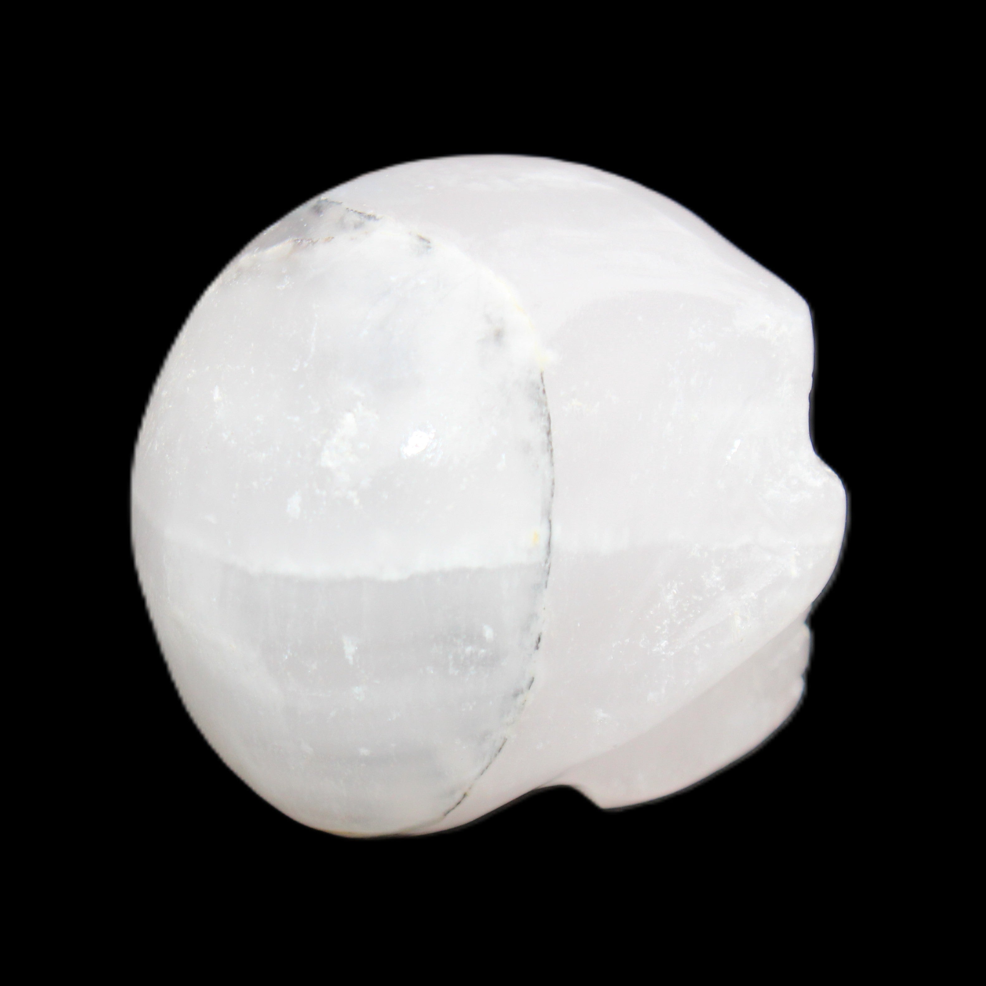 Mangano Calcite skull 35*47*40mm 117g in sunlight - Rocks and Things Store