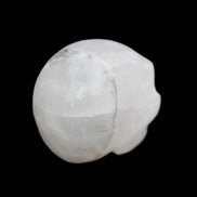 Mangano Calcite skull 35*47*40mm 117g in sunlight - Rocks and Things Store