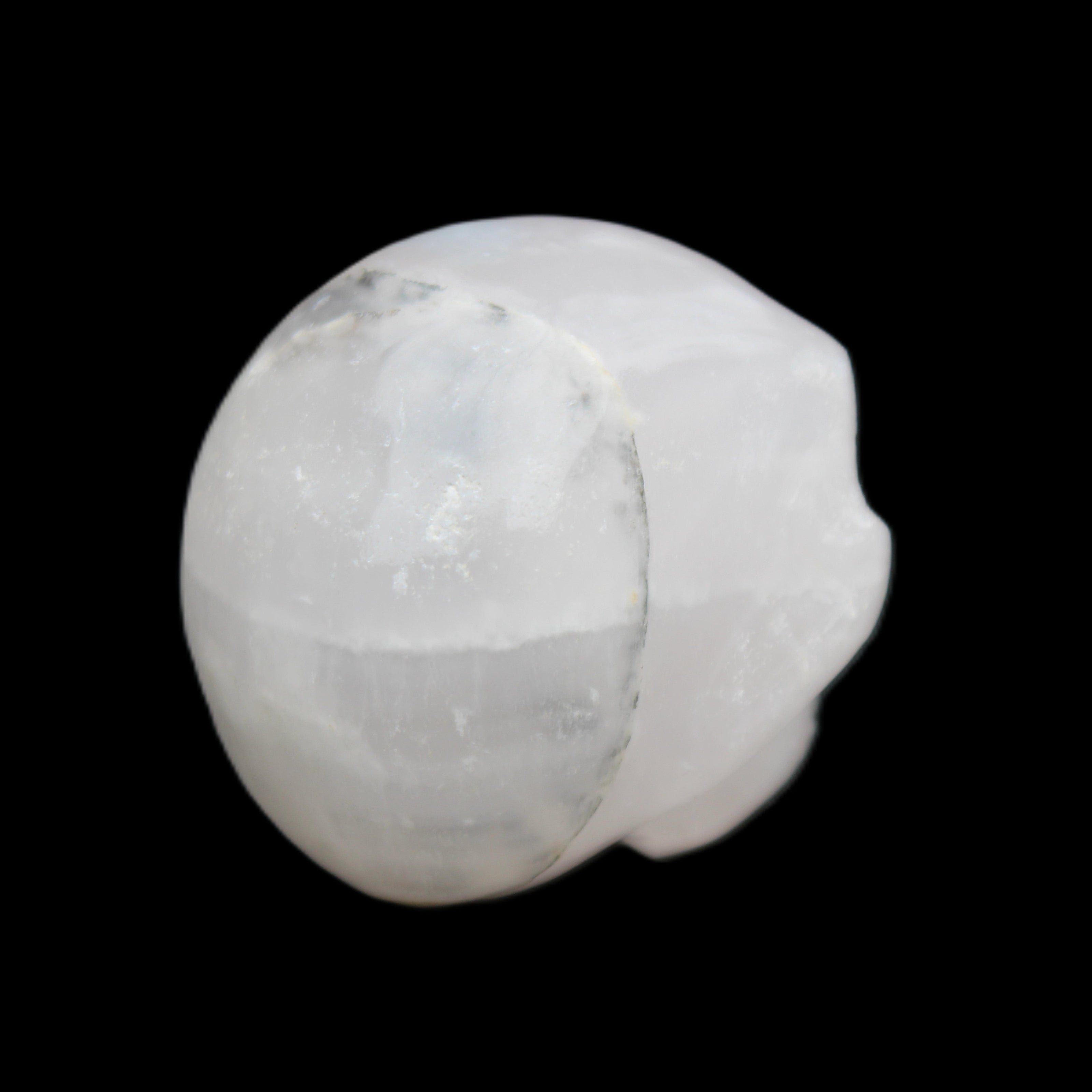 Mangano Calcite skull 35*47*40mm 117g in sunlight - Rocks and Things Store