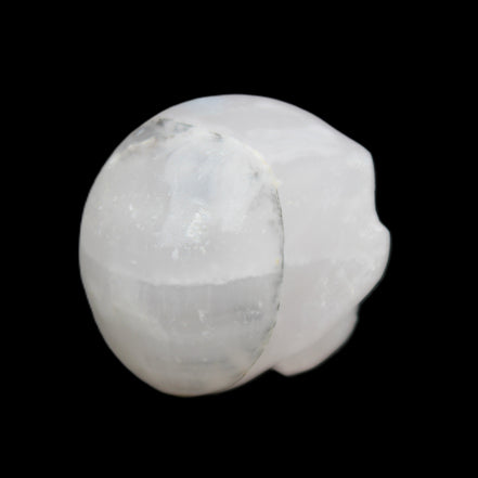 Mangano Calcite skull 35*47*40mm 117g in sunlight - Rocks and Things Store