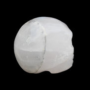 Mangano Calcite skull 35*47*40mm 117g in sunlight - Rocks and Things Store