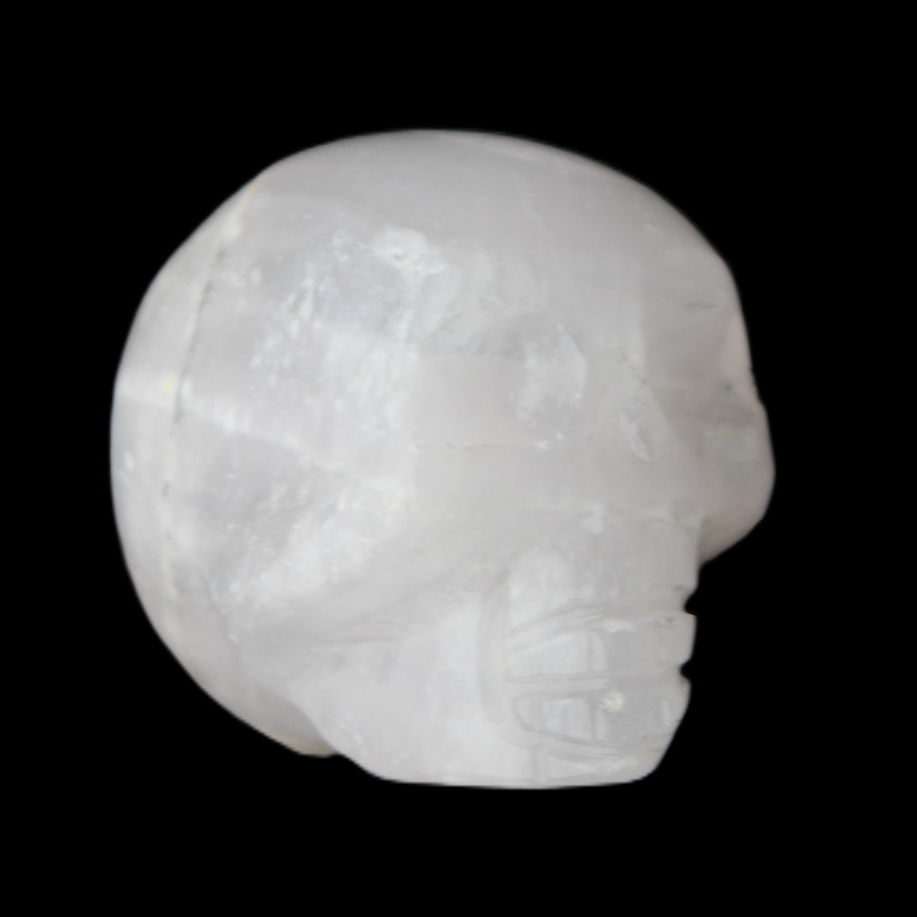 Mangano Calcite skull 35*47*40mm 117g in sunlight - Rocks and Things Store