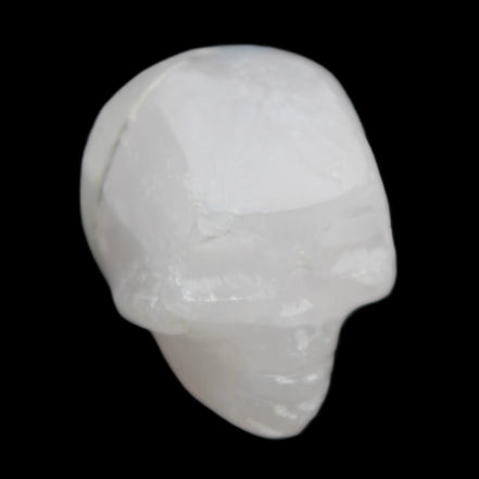 Mangano Calcite skull 35*47*40mm 117g in sunlight - Rocks and Things Store