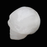 Mangano Calcite skull 35*47*40mm 117g in sunlight - Rocks and Things Store