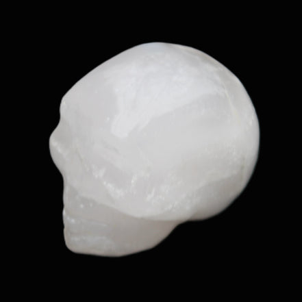 Mangano Calcite skull 35*47*40mm 117g in sunlight - Rocks and Things Store