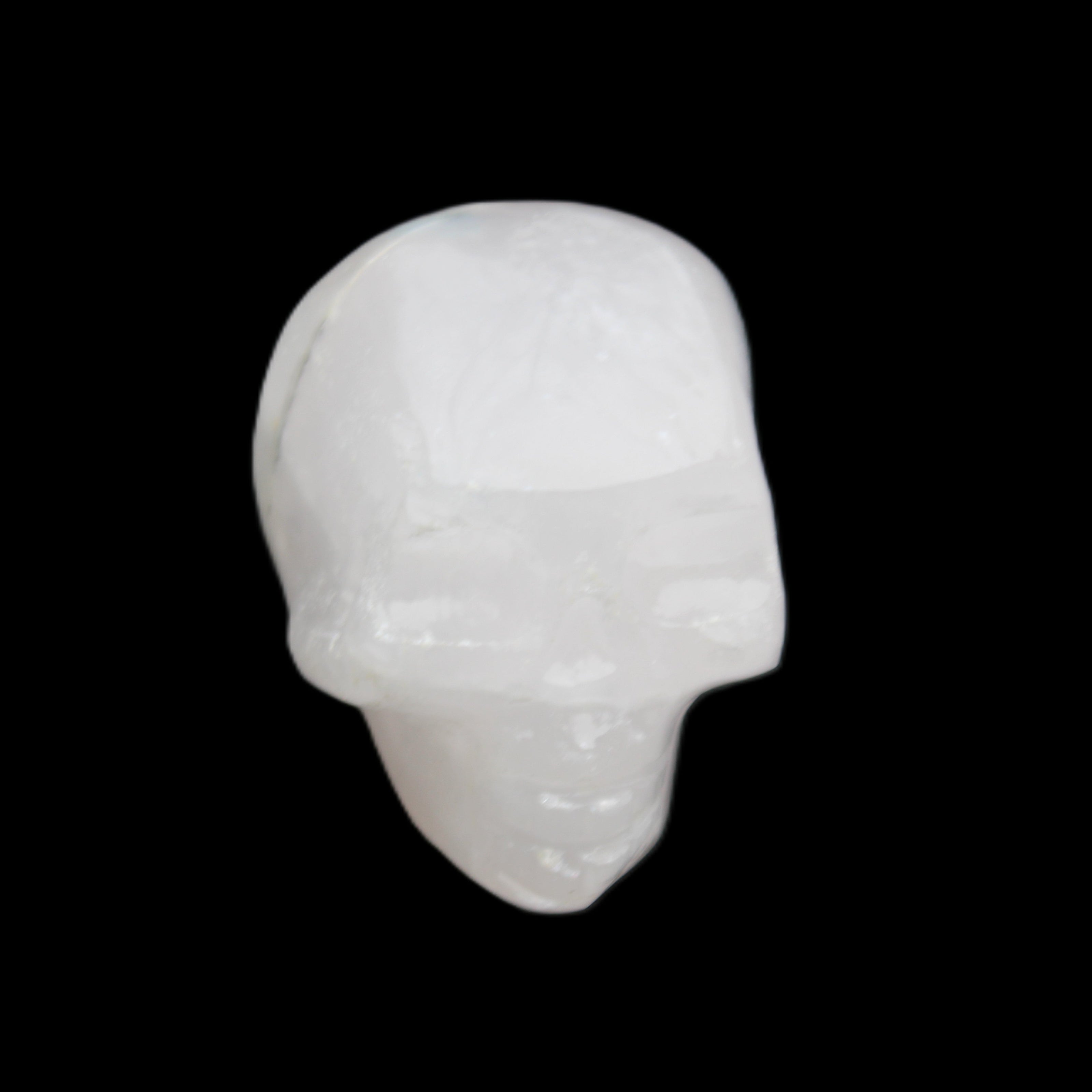 Mangano Calcite skull 35*47*40mm 117g in sunlight - Rocks and Things Store