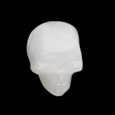 Mangano Calcite skull 35*47*40mm 117g in sunlight - Rocks and Things Store