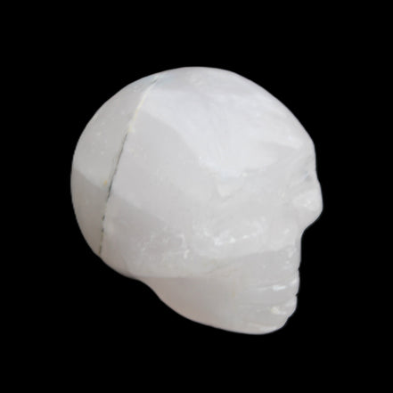 Mangano Calcite skull 35*47*40mm 117g in sunlight - Rocks and Things Store