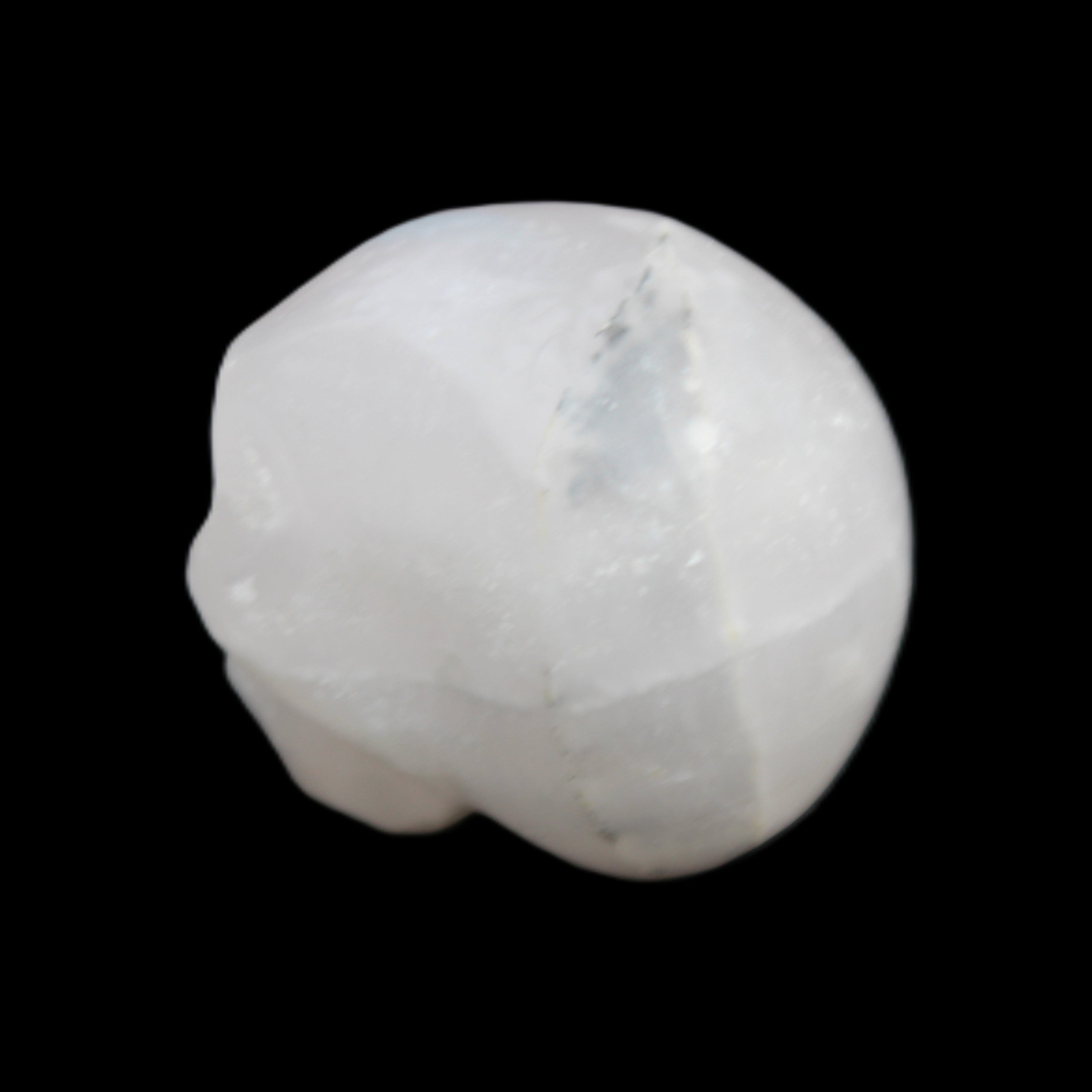 Mangano Calcite skull 35*47*40mm 117g in sunlight - Rocks and Things Store
