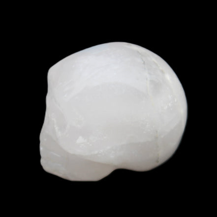 Mangano Calcite skull 35*47*40mm 117g in sunlight - Rocks and Things Store