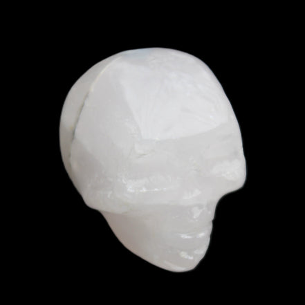 Mangano Calcite skull 35*47*40mm 117g in sunlight - Rocks and Things Store