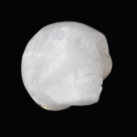 Mangano Calcite skull 35*47*40mm 117g in sunlight - Rocks and Things Store