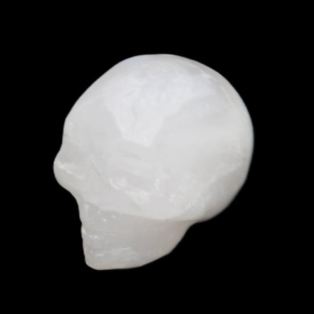 Mangano Calcite skull 35*47*40mm 117g in sunlight - Rocks and Things Store