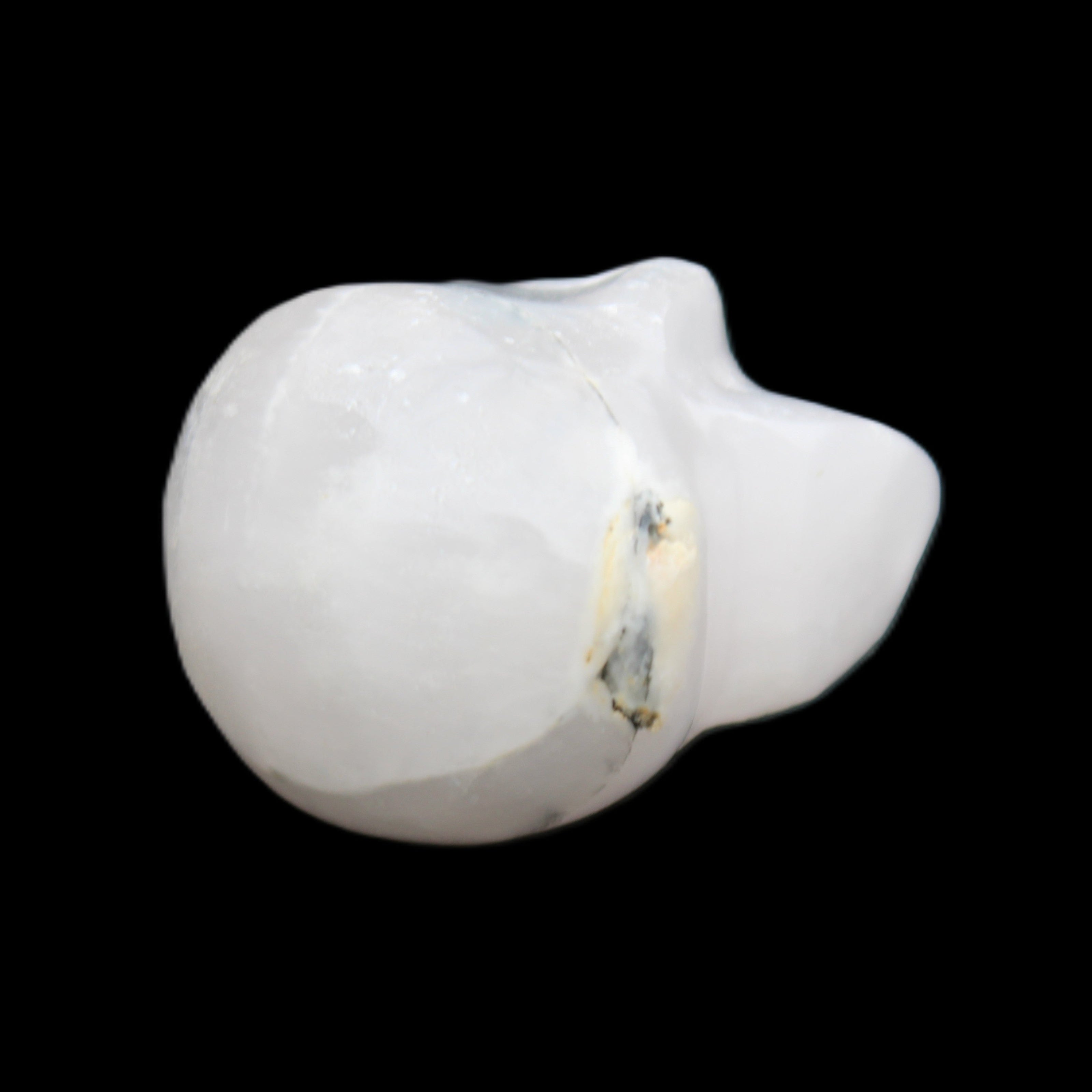 Mangano Calcite skull 35*47*40mm 117g in sunlight - Rocks and Things Store
