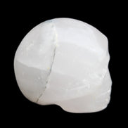 Mangano Calcite skull 35*47*40mm 117g in sunlight - Rocks and Things Store