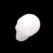 Mangano Calcite skull 24*38*32mm 48g in sunlight - Rocks and Things Store