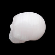 Mangano Calcite skull 24*38*32mm 48g in sunlight - Rocks and Things Store