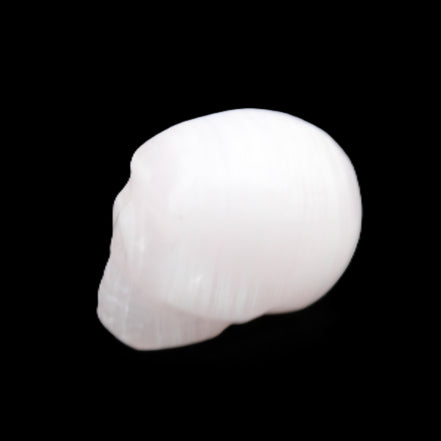 Mangano Calcite skull 24*38*32mm 48g in sunlight - Rocks and Things Store