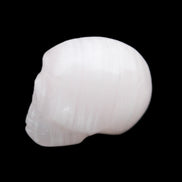 Mangano Calcite skull 24*38*32mm 48g in sunlight - Rocks and Things Store