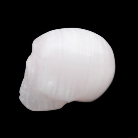 Mangano Calcite skull 24*38*32mm 48g in sunlight - Rocks and Things Store