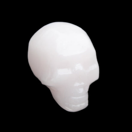 Mangano Calcite skull 24*38*32mm 48g in sunlight - Rocks and Things Store