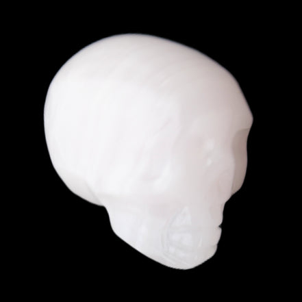Mangano Calcite skull 24*38*32mm 48g in sunlight - Rocks and Things Store
