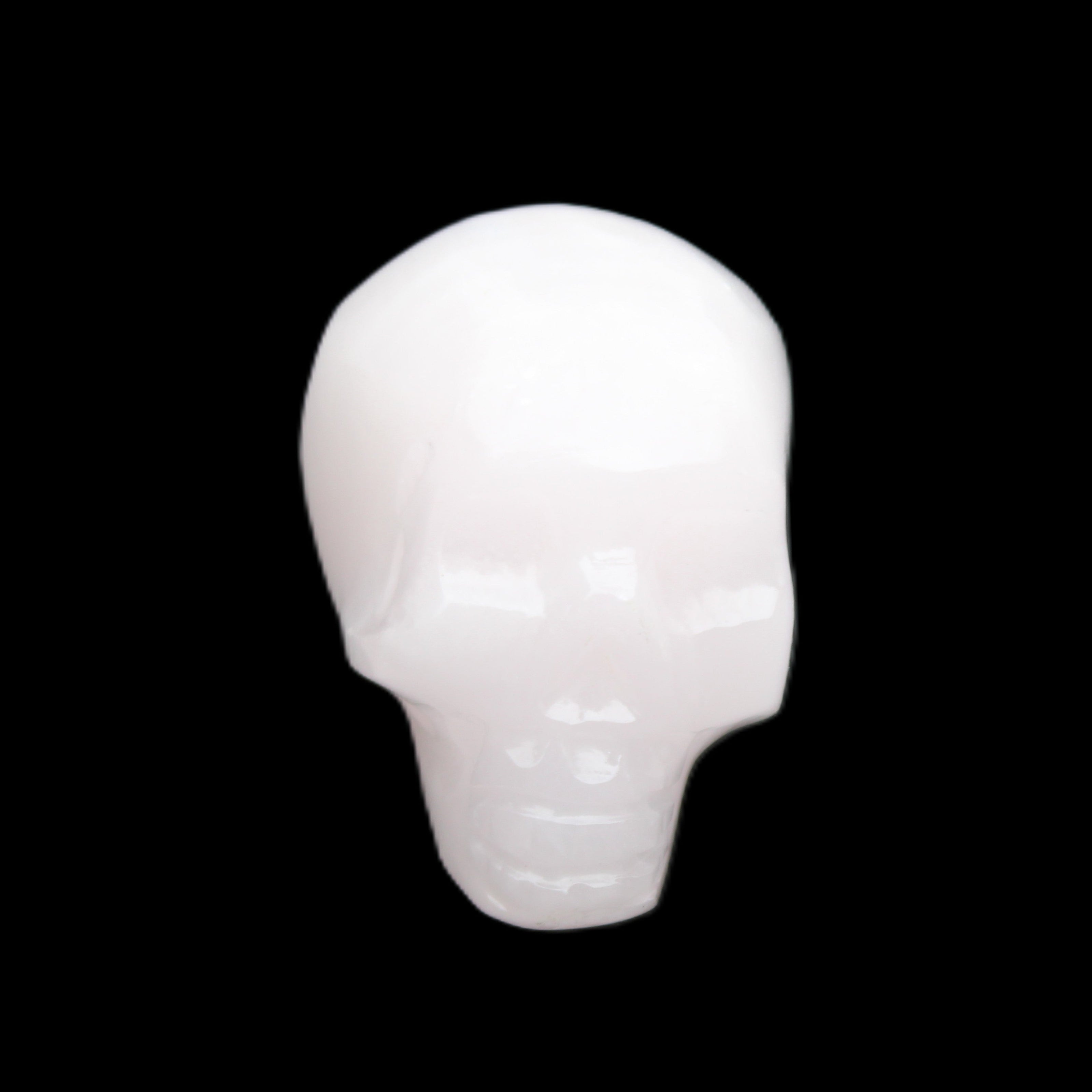 Mangano Calcite skull 24*38*32mm 48g in sunlight - Rocks and Things Store