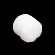 Mangano Calcite skull 24*38*32mm 48g in sunlight - Rocks and Things Store