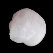 Mangano Calcite skull 24*38*32mm 48g in sunlight - Rocks and Things Store