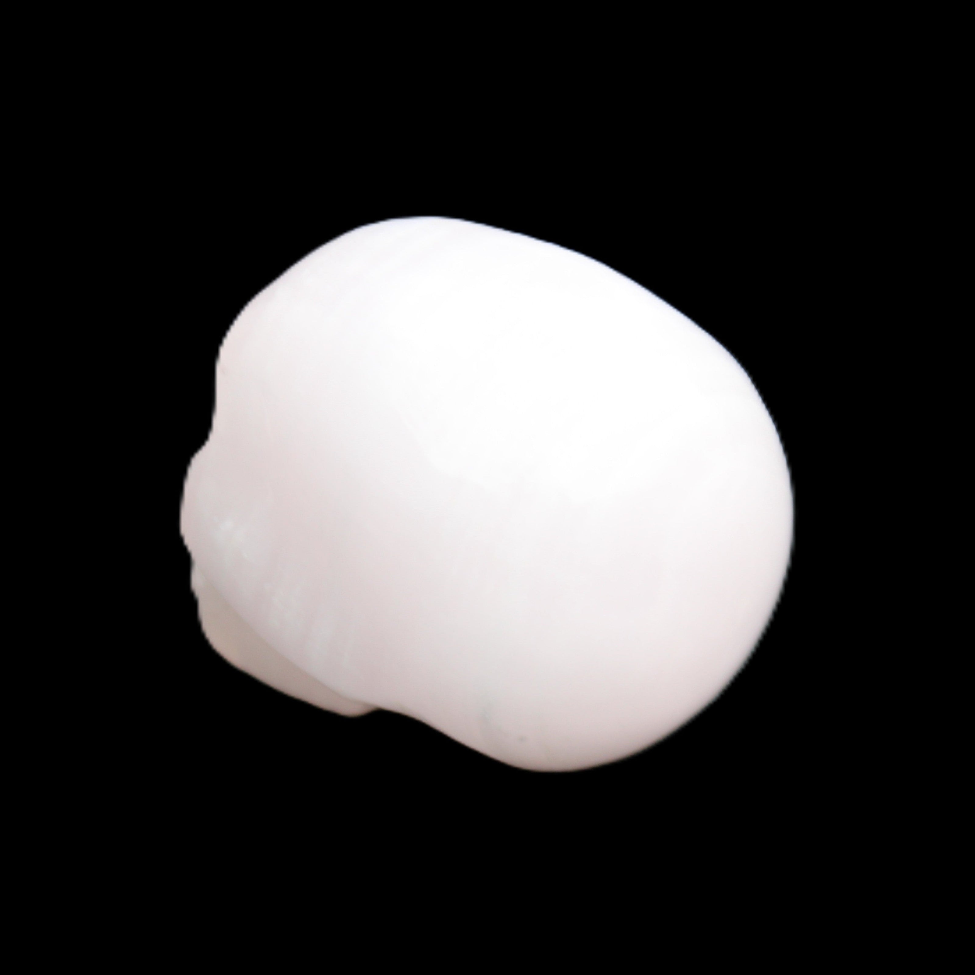 Mangano Calcite skull 24*38*32mm 48g in sunlight - Rocks and Things Store