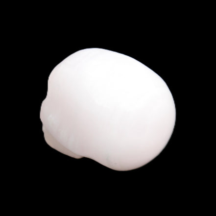 Mangano Calcite skull 24*38*32mm 48g in sunlight - Rocks and Things Store