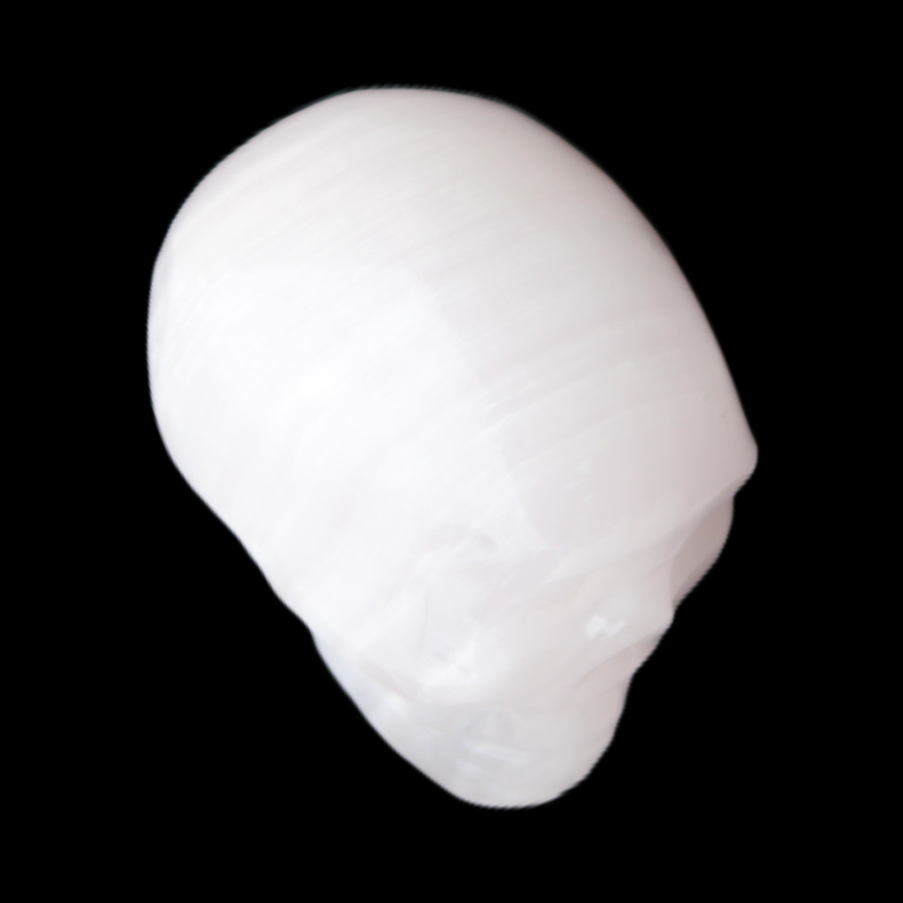 Mangano Calcite skull 24*38*32mm 48g in sunlight - Rocks and Things Store
