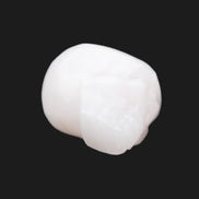 Mangano Calcite skull 24*38*32mm 48g in sunlight - Rocks and Things Store