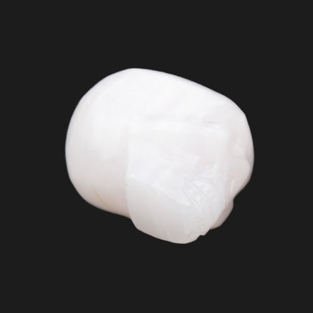 Mangano Calcite skull 24*38*32mm 48g in sunlight - Rocks and Things Store